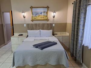 Sleep 'n Go Guesthouse客房内的一张或多张床位
