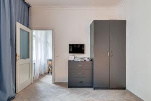 Televízia a/alebo spoločenská miestnosť v ubytovaní Vita Nejedleho apartments