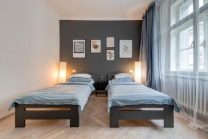 Posteľ alebo postele v izbe v ubytovaní Vita Nejedleho apartments