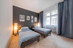 Posteľ alebo postele v izbe v ubytovaní Vita Nejedleho apartments