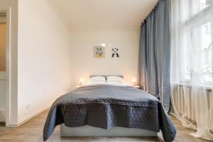 Posteľ alebo postele v izbe v ubytovaní Vita Nejedleho apartments