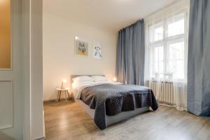 Posteľ alebo postele v izbe v ubytovaní Vita Nejedleho apartments