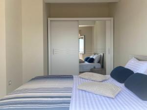 a bed with two pillows on it in a bedroom at Apartment Azuri in Okrug Donji