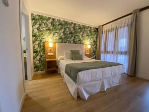 Postel nebo postele na pokoji v ubytování Hotel Rural - El Rincón de Don Pelayo