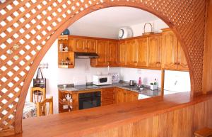 Virtuvė arba virtuvėlė apgyvendinimo įstaigoje Vivienda Miramar