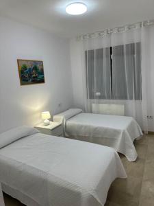Ένα ή περισσότερα κρεβάτια σε δωμάτιο στο Alojamiento Los Cipreses