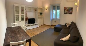 a living room with a couch and a table at Mary's House in Rome