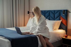 Postel nebo postele na pokoji v ubytování Hotel Faros Gdansk Airport
