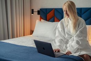 Postel nebo postele na pokoji v ubytování Hotel Faros Gdansk Airport