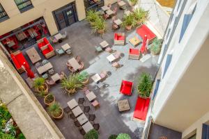 an overhead view of a patio with chairs and plants at Aparthotel Adagio Montpellier Centre Comedie in Montpellier