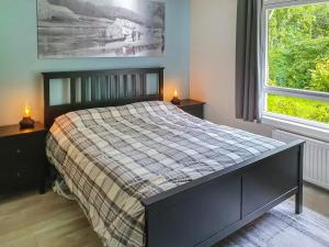 Кровать или кровати в номере Ferry Cottage