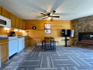 a kitchen with a ceiling fan and a stove at Relax, Adventure, Views, Amenities+Memories (Full) in Granby
