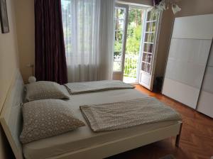 Posteľ alebo postele v izbe v ubytovaní Anna apartman
