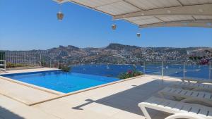 a swimming pool on the roof of a house with a view at MAGNIFICENT VIEW with Private Pool & Piano, 3 Bedroom Villa, MIN 4 nigths in Gundogan