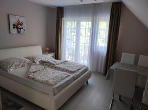 Posteľ alebo postele v izbe v ubytovaní Anna apartman