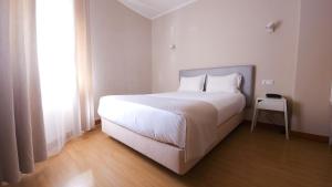 Кровать или кровати в номере Hotel Laitau