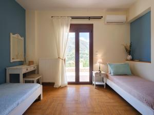 Posteľ alebo postele v izbe v ubytovaní Ageri Traditional Villa