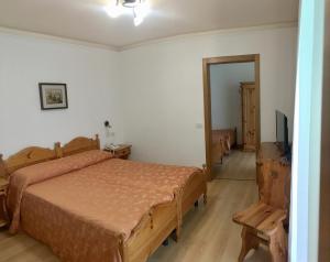 Postel nebo postele na pokoji v ubytování Hotel Juventus + 37 fotografií