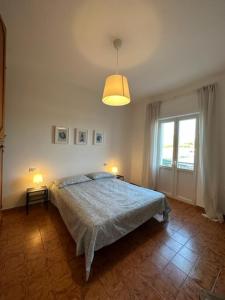 Cama ou camas em um quarto em Casa Lea - Sperlonga