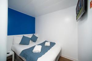 Postel nebo postele na pokoji v ubytování CiTi Hotel London Luton