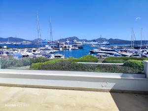 a view from a window of a marina with boats at Kary Studio Apartment in Olbia
