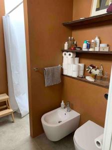 a bathroom with a white toilet and a sink at Unique boathouse. in Copenhagen