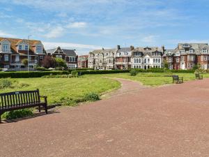 a park with a bench and a row of houses at Beach Bungalow in Belton