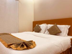 Llit o llits en una habitació de Oasis Residential