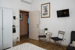 TV a/nebo společenská místnost v ubytování B&B Pisaland