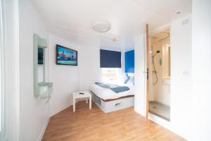 Postel nebo postele na pokoji v ubytování CiTi Hotel London Luton