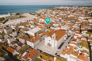 an aerial view of a city with a green stop sign at Best Houses 102 - Hut Spot Peniche in Peniche