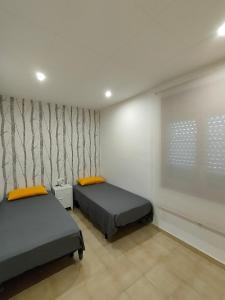 A bed or beds in a room at Ca la Mercè