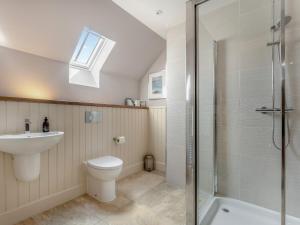 a bathroom with a toilet and a sink and a shower at Mayflower - Uk43632 in Grange