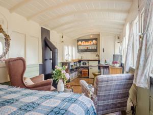 a living room with a bed and a kitchen at Just The Ticket - Uk44791 in Barney