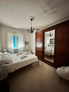a bedroom with a bed and a large mirror at ENDLESS SUMMER in Gaeta