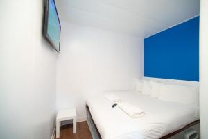 Postel nebo postele na pokoji v ubytování CiTi Hotel London Luton