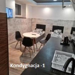 Televízia a/alebo spoločenská miestnosť v ubytovaní Eldom-Noclegi Rogozińska 29E