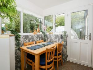 a dining room with a table and chairs at Fernleigh Villa Annexe in Wisbech