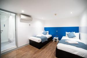 Postel nebo postele na pokoji v ubytování CiTi Hotel London Luton