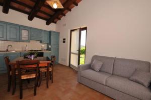 a living room with a couch and a table at Agriturismo Casale Contessa in Montebuono