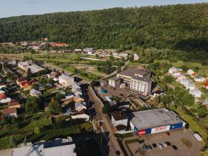 an aerial view of a small town in a mountain at Typton hotel&spa in Medzilaborce