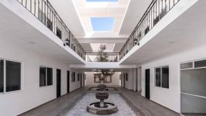 an empty hallway with a skylight in a building at Hotel Posada San Esteban in San Luis Potosí