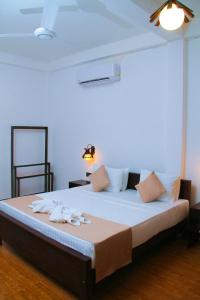 Voodi või voodid majutusasutuse Amare Safari Resort Udawalawe toas