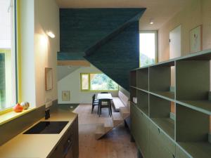 a kitchen with a staircase leading to a dining room at Bleibe Menzenschwand in St. Blasien