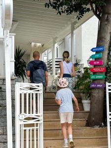 a group of people walking down the stairs of a house at hi HOTEL IVY BÜYÜKADA in Adalar