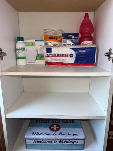 a shelf in a refrigerator with food and other items at Attico Etnamare in Gravina di Catania