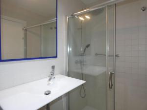 a bathroom with a shower and a sink and a glass shower door at apartamento gran bilbao II in Barakaldo