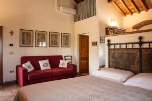 Postel nebo postele na pokoji v ubytování Agriturismo Il Calesse