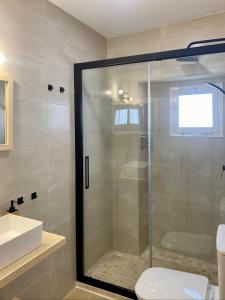 a bathroom with a shower with a toilet and a sink at CasaElbarranko in Arcos de la Frontera +45 photos