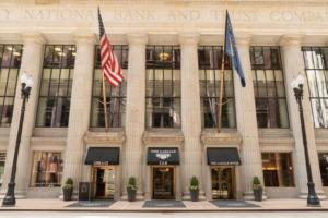 a building with two flags in front of it at The LaSalle Chicago, Autograph Collection in Chicago